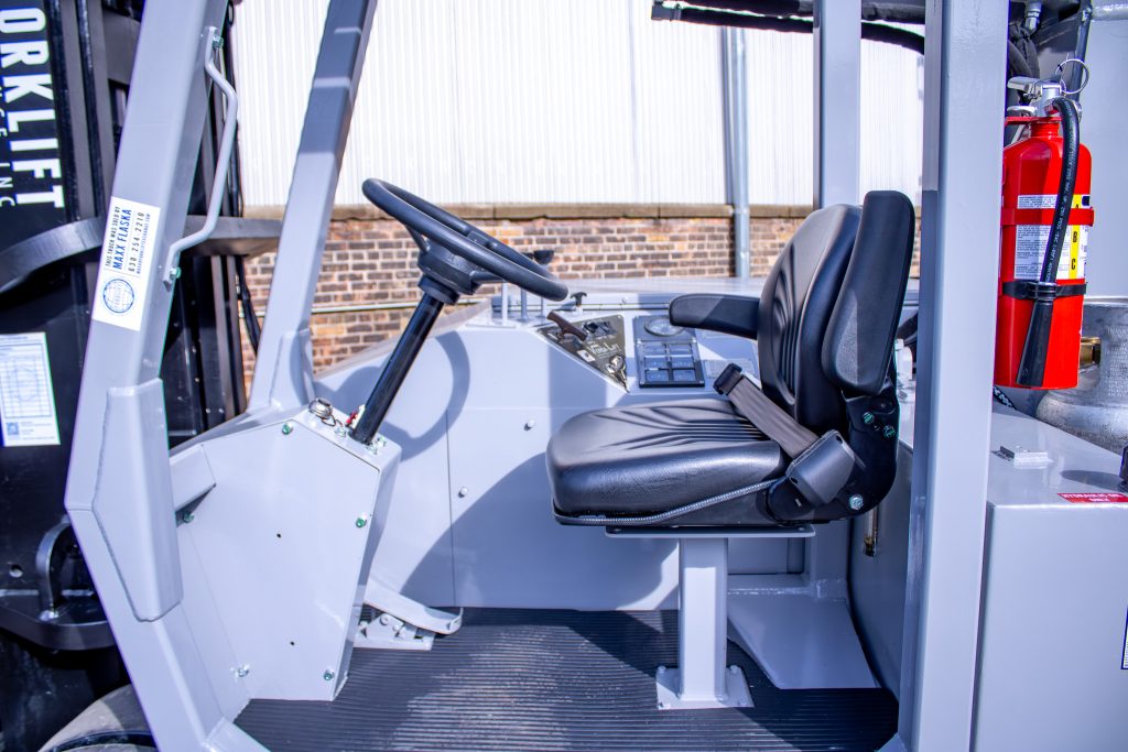 Restored operator station with new seat and refurbished controls.