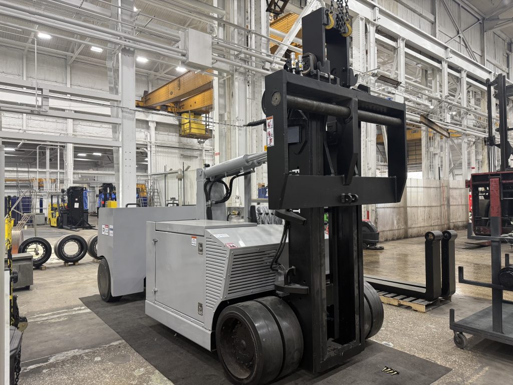 Reinstalling sheet metal during Versa Lift 40/60 reassembly.