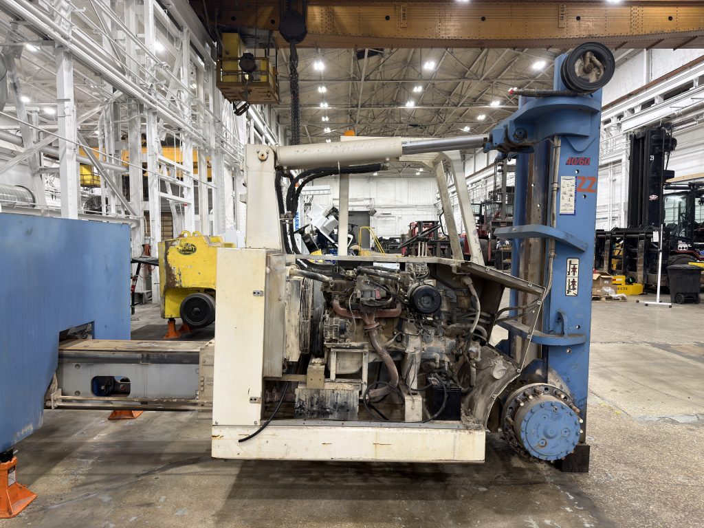 GM 3.0L engine compartment opened for service during refurbishment.