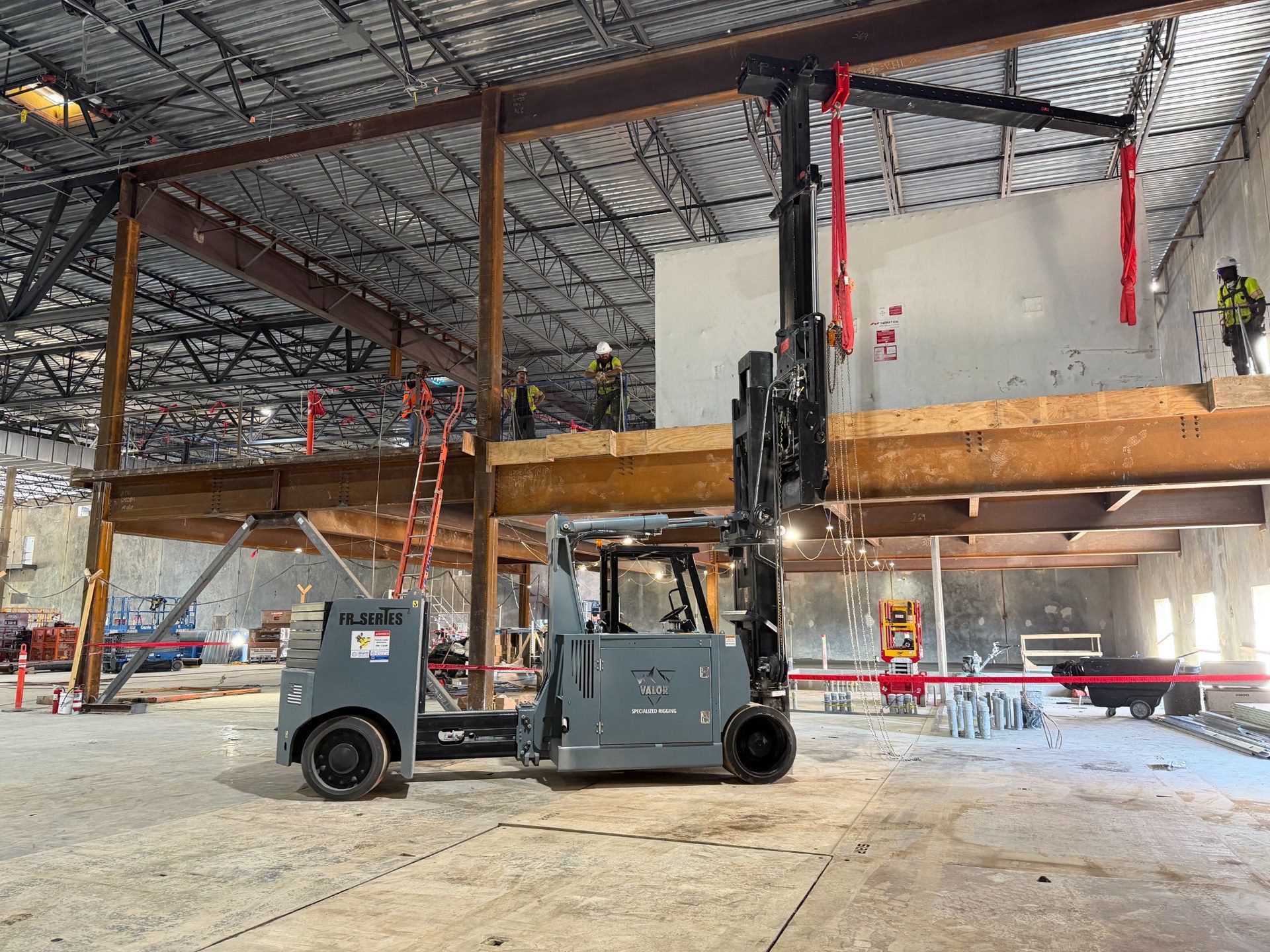 How Valor Specialized Rigging Moved a 15,000 lb Air Handler with a Hoist FR 40/60 Hoist FR 40/60 with an extended boom beside a wrapped Nortek air handler on a mezzanine