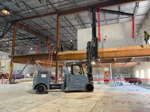 Hoist FR 40/60 with an extended boom beside a wrapped Nortek air handler on a mezzanine